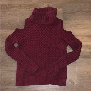 Sweater with shoulder cut outs